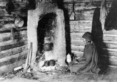 Native woman and fireplace